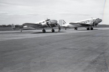 Bill Lythgoe Photo: CF-DTP, Lockheed 12-A Electra Junior, and RCAF KN261, Douglas C-47B, 1950s